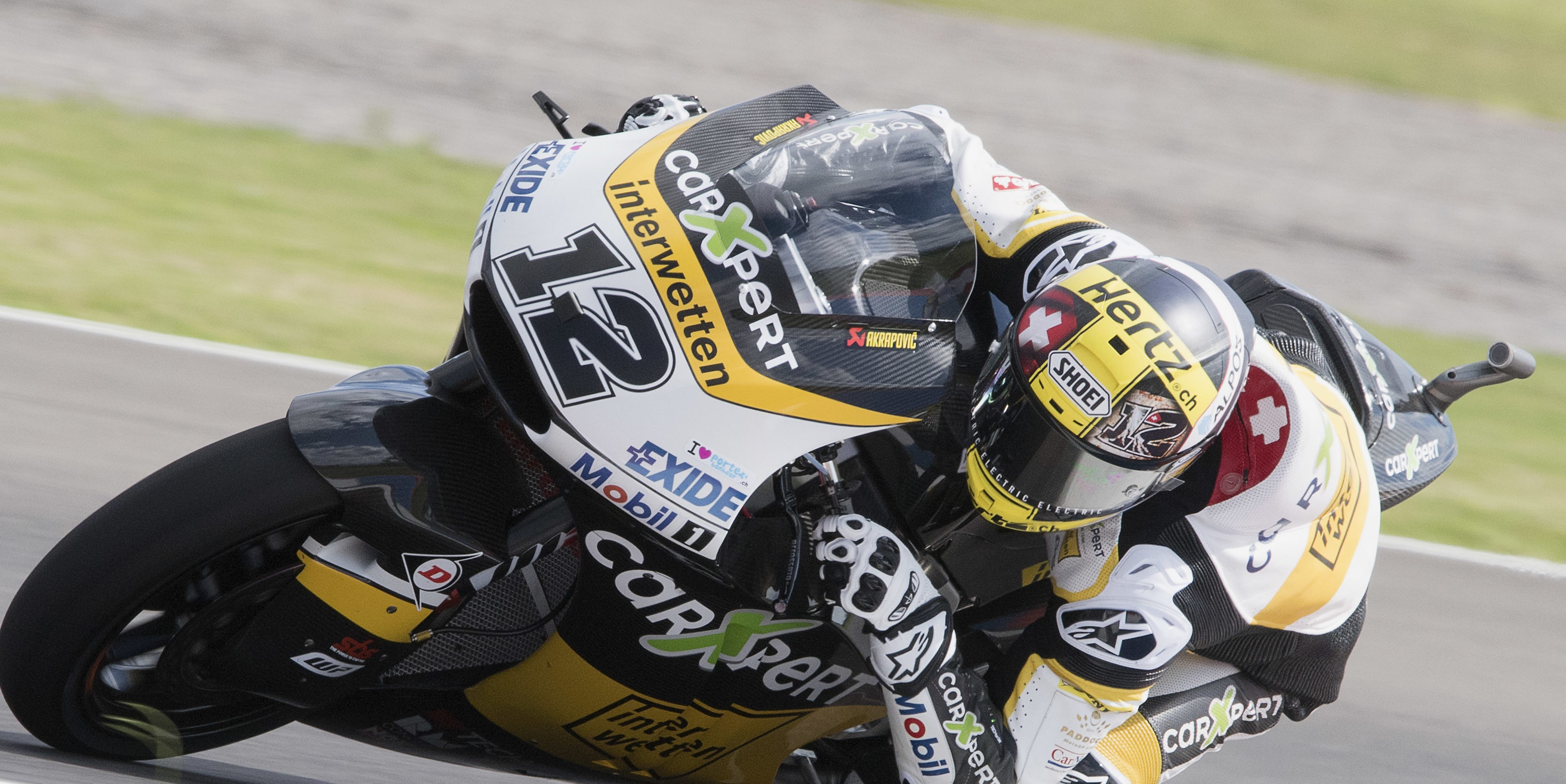 Tom Luthi battles to pole in Moto2