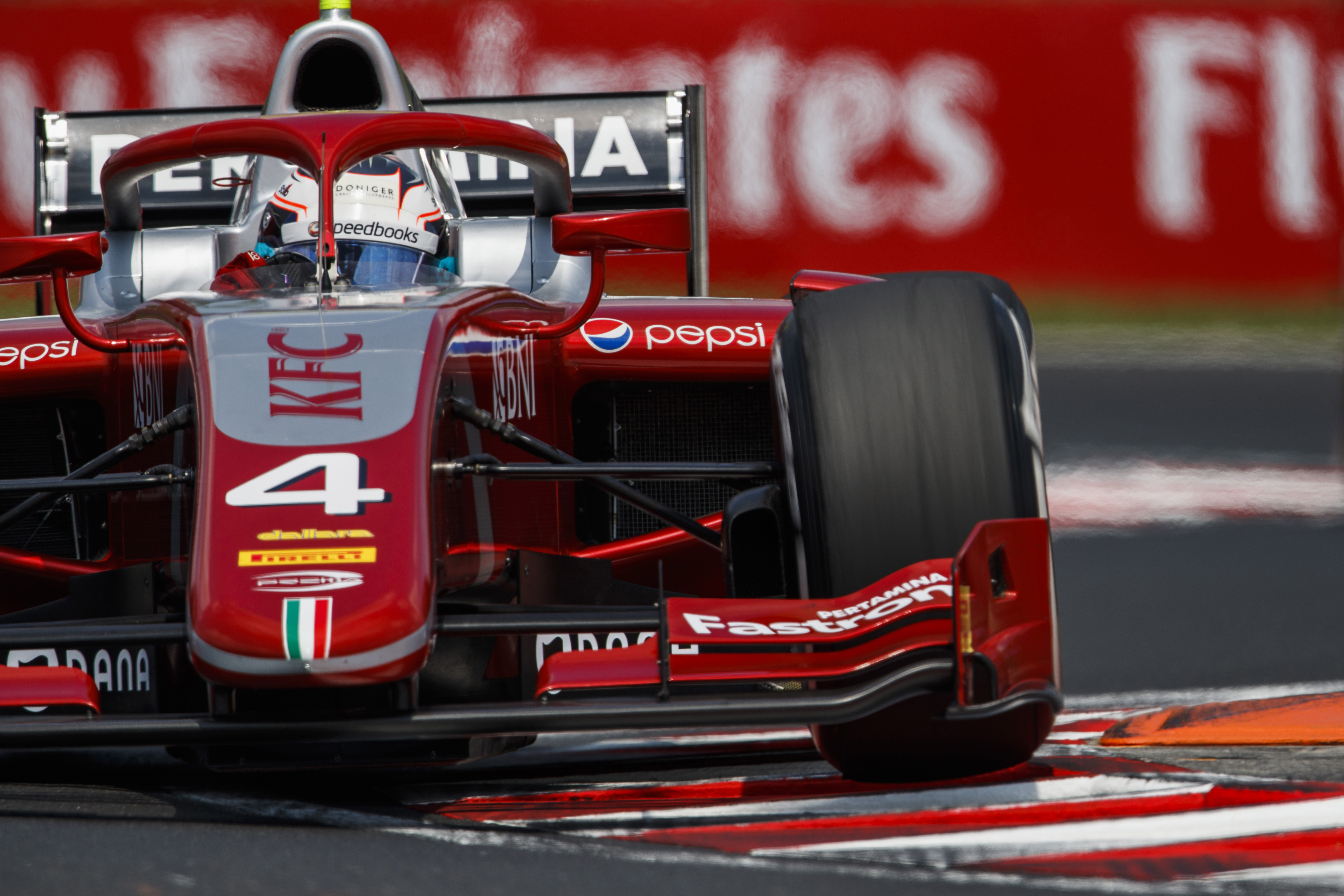 De Vries charges to F2 feature win in wet-dry race