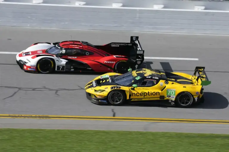 January 24, 2026, Daytona Beach, Florida, USA: The #7 Porsche Penske Motorsport, Porsche 963, GTP driven by Felipe Nasr, Julien Andlauer, Laurin Heinrich, passes the #70 Inception Racing, Ferrari 296 GT3 EVO, driven by Brendan Iribe, Frederik Schand