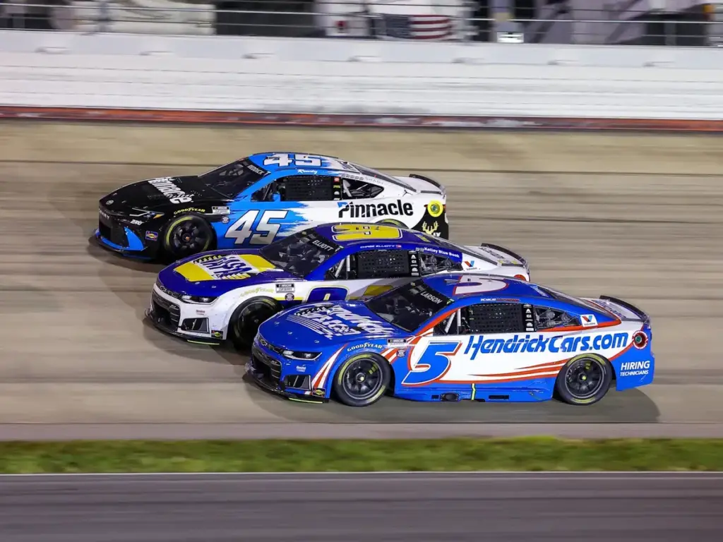 May 31, 2026, Lebanon, Tennessee, USA: Hendrick Motorsports driver Kyle Larson (5), Hendrick Motorsports driver Chase Elliott (9), and 23XI Racing driver Tyler Reddick (45) race three-wide during the Cracker Barrel 400 NASCAR Cup Series race at Nashv