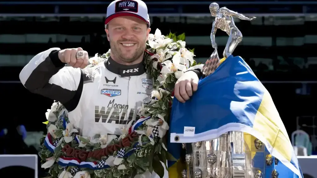 Felix Rosenqvist Borg-Warner Trophy: Felix Rosenqvist posing with the Borg-Warner Trophy following his Indianapolis 500 victory.