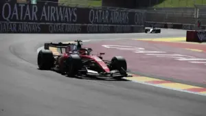 Charles Leclerc Lewis Hamilton Ferrari: Charles Leclerc driving a Ferrari F1 car on a race track.