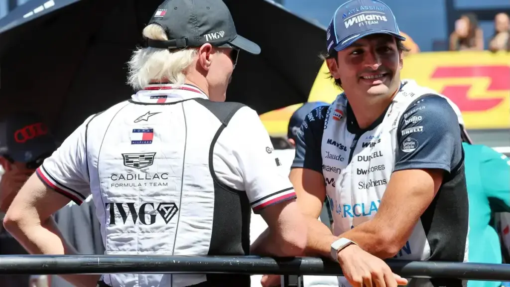 Carlos Sainz Azerbaijan grid penalty: Carlos Sainz talking to Valtteri Bottas during a drivers' parade
