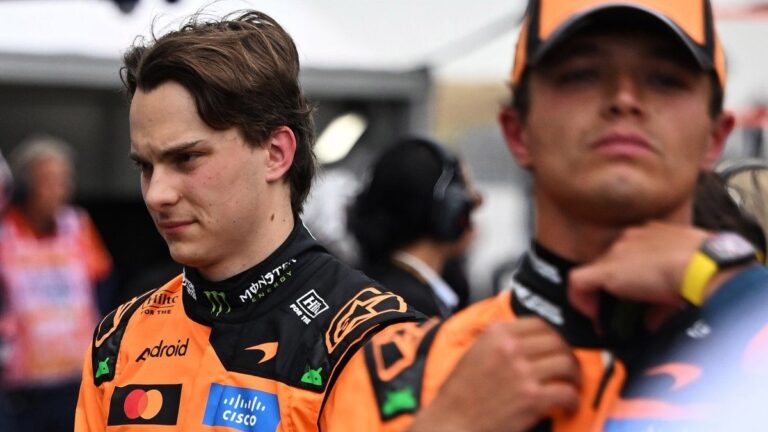 Oscar Piastri Baku podium error: Oscar Piastri in McLaren team gear in the paddock area alongside teammate Lando Norris