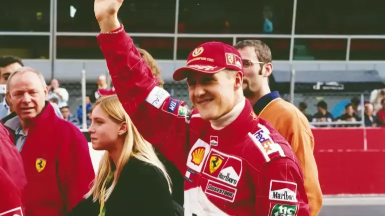 Corinna Schumacher Michael memories: Michael Schumacher waving in Ferrari gear during his F1 career.