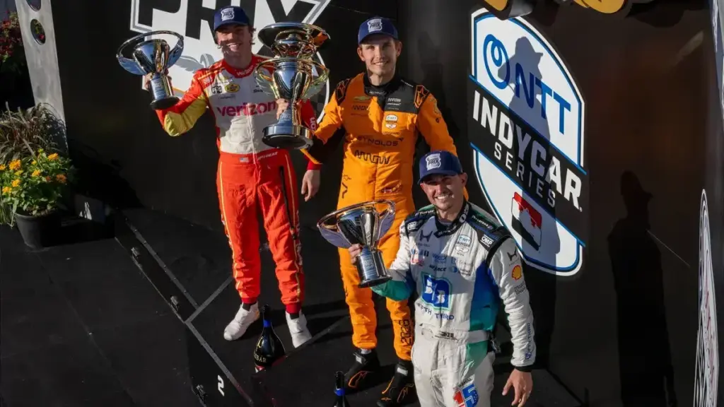 Christian Lundgaard Chip Ganassi: Christian Lundgaard celebrating on an IndyCar podium after winning the Sonsio Grand Prix.