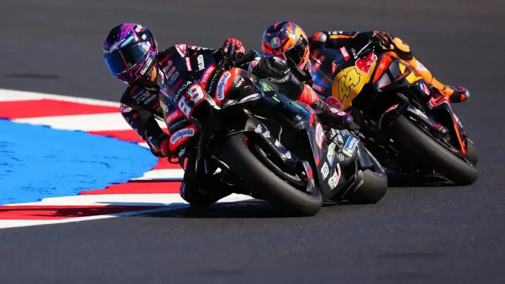 Michelin bans soft tyre: Jorge Martin racing in a MotoGP cornering battle, with another rider close behind.