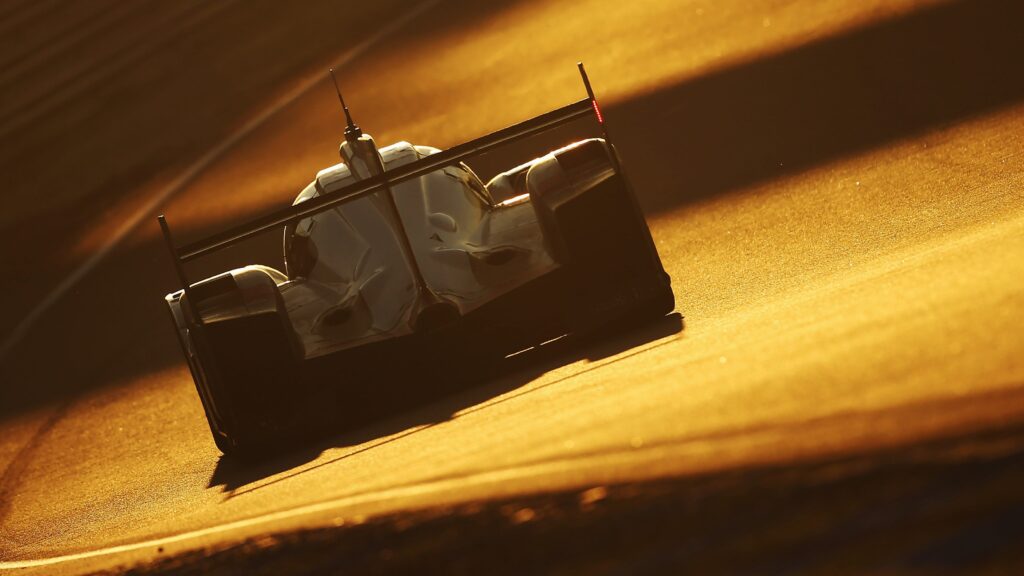 Le Mans 24 Hours FIA deal: An endurance racing prototype car on track during the 24 Hours of Le Mans in golden hour lighting.